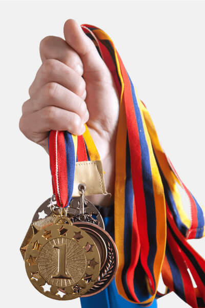 Picture of a child holding math medals