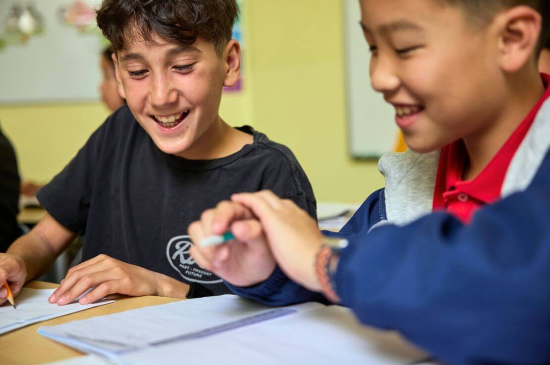 two boys working on math classwork together