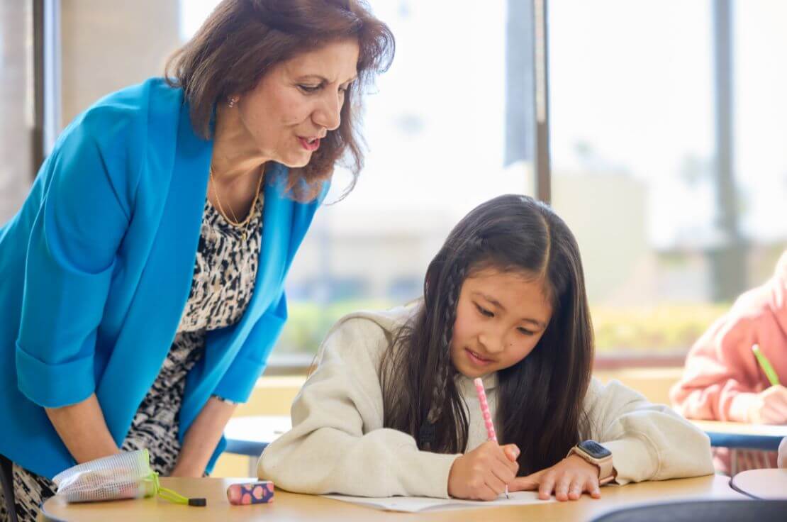 teacher and student in math classroom